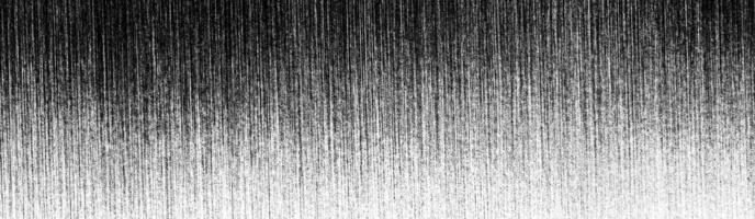 Metal texture with white scratches. Abstract noise black background overlay for design. photo