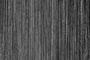 Metal texture with white scratches. Abstract noise black background overlay for design. photo