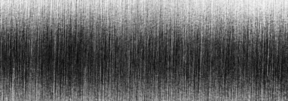 Metal texture with white scratches. Abstract noise black background overlay for design. photo