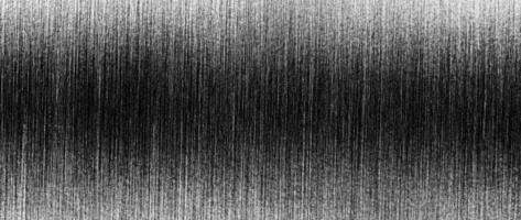 Metal texture with white scratches. Abstract noise black background overlay for design. photo