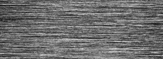 Metal texture with white scratches. Abstract noise black background overlay for design. photo