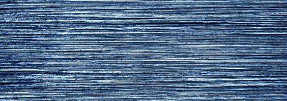 Metal texture with white scratches. Abstract noise black background overlay for design. photo