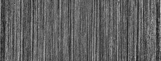 Metal texture with white scratches. Abstract noise black background overlay for design. photo