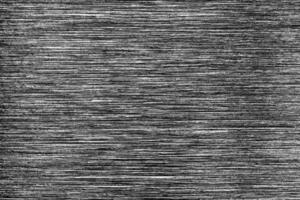 Metal texture with white scratches. Abstract noise black background overlay for design. photo