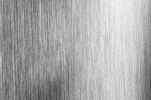 Metal texture with white scratches. Abstract noise black background overlay for design. photo