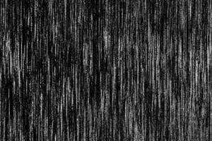 Black metal texture with white scratches. Abstract noise black background overlay for design. photo