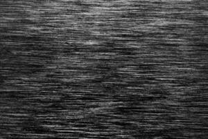 Black metal texture with white scratches. Abstract noise black background overlay photo