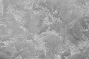 Texture of gray decorative plaster or concrete. Abstract black and white backdrop for design. photo