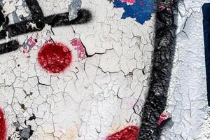 Fragment of colored graffiti painted on a wall. Bright abstract background. photo