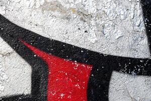 Fragment of colored graffiti painted on a wall. Bright abstract background. photo