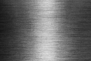 Silver metal texture with white scratches. Abstract noise black background overlay for design. photo