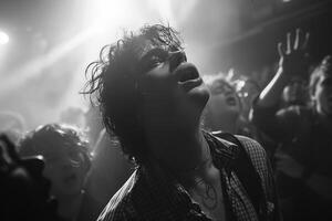 A black and white photograph showing a man in a crowd under the sky photo