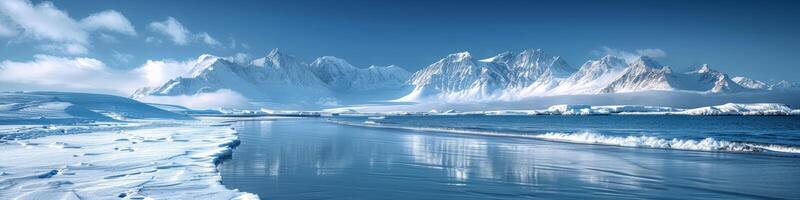A vast expanse of water encircled by snowcapped mountains photo