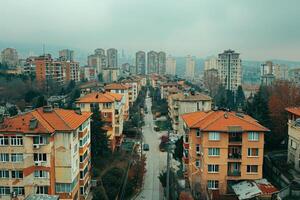 Cityscape with tall buildings viewed from above under cloudy daytime sky photo