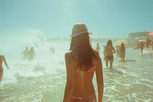 A woman wearing a bikini is strolling towards the sea photo