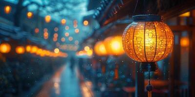 A lantern hangs on a building, illuminated by rain under the sky photo