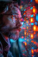 A man wearing glasses and a beard peers through a window photo