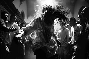 A photo depicting a man dancing in a crowd, captured in black and white