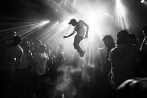 A black and white photograph of a man leaping in midair photo