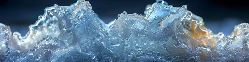 A closeup image of water splashing on a blue backdrop photo