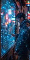In the dim streets of the city at night, a man interacts with a digital display under neon lights photo