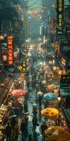 Crowd walking down a busy street in rain with umbrellas photo