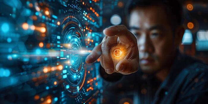 A man in darkness pressing a button on futuristic screen with blue light photo