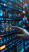 A finger points towards a screen displaying multiple numerical figures photo