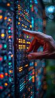 Closeup of a persons hand pressing a button on a control panel photo