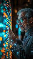Man in suit and tie touches screen with face covered in dots photo