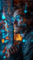 A man in glasses looks through a window, surrounded by electric blue photo
