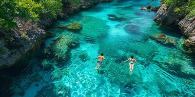 A man and a woman are enjoying a swim in the ocean together on a beautiful day photo