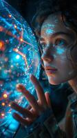 Woman with blue lights on her face holds glass sphere at event photo