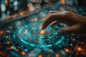 A hand is pressing a button on a futuristic screen with an electric blue glow photo