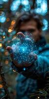 A man is holding a blue glowing object in his hand underwater photo