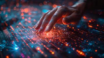 A closeup view of a persons hand making contact with a computer screen photo
