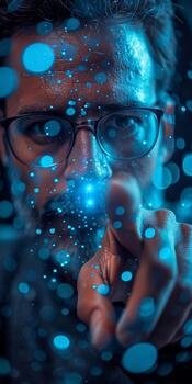 A man with glasses is pointing at something with his finger photo