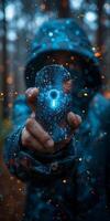 A person in a hooded jacket is holding a key in their hand, standing outdoors photo