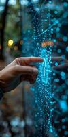 A close up of a persons hand interacting with a digital touch screen photo