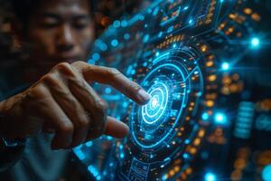 A man is using his finger to interact with a hightech display screen photo