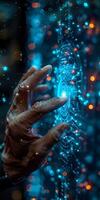A close up of a persons hand touching a screen under water photo