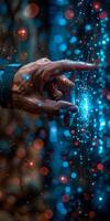 A detailed view of a persons hand touching a shimmering object photo
