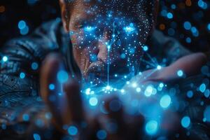 A man holds a digital image of his face in darkness, with artistic touch photo