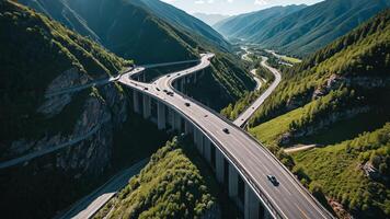 aerial view of highway, road, overpass on mountain cliff photo