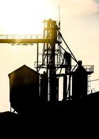 silhouette agricultural elevator building for storage grain photo