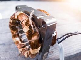 Electric motor winding coil , three phase induction motor winding coil assembly, procedure for replacing.With shiny light. photo