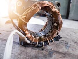 Electric motor winding coil , three phase induction motor winding coil assembly, procedure for replacing.With shiny light. photo