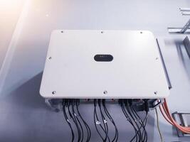 Instalation control of inverters solar panel on the wall. Technology of solar energy with shiny light. photo