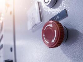 Close up the Emergency Push Button isolated on the control panel. photo