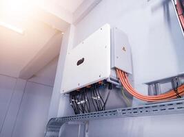 Instalation control of inverters solar panel on the wall. Technology of solar energy with shiny light. photo